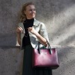 Smooth leather tote bag, burgundy color - worn by a model