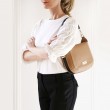 Crossbody bag "NEW FRENCHY" in grained leather, beige color, on a shoulder