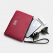 SUZY, grained leather zipper pouch in pink raspberry with black wrist strap - with mobile phone and sunglasses