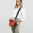 Crossbody bag "NEW FRENCHY" in grained leather, red hibiscus color, on a model
