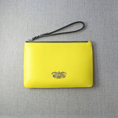 SUZY, grained leather zipper pouch, lemon yellow color with black wrist strap - on linen