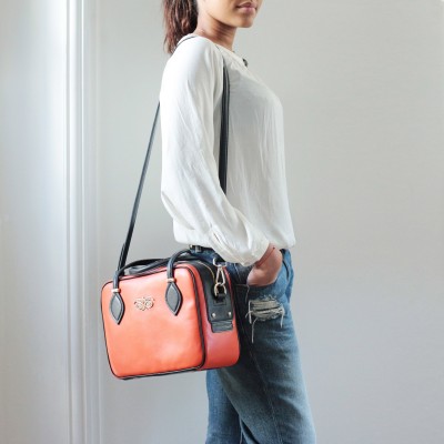 Leather handbag with removable strap, navy orange color - on a model