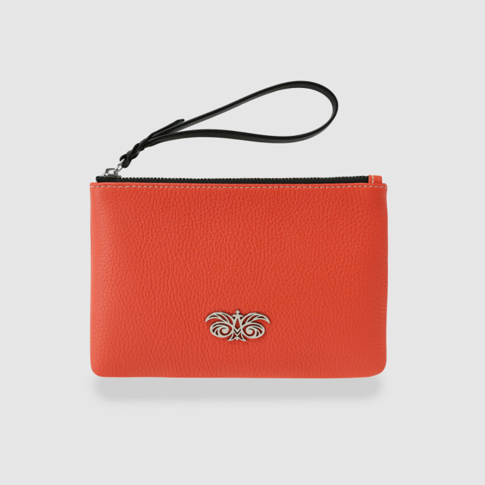 SUZY, grained leather zipper pouch in red hibiscus color with black wrist strap - front view