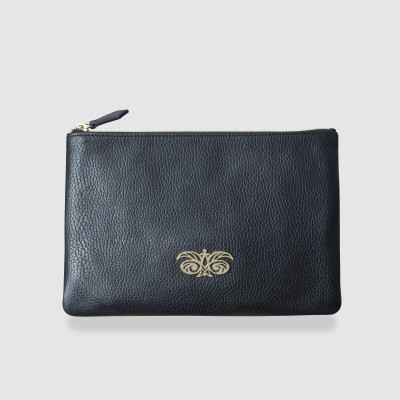 Zipper pouch OSLO in black grained calfskin with light gold metals and yellow ochre moire lining  - front view