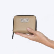 Compact zippered wallet in grained calf leather "MANON", Beige color - in hand